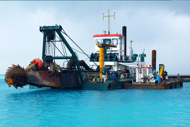Industrial Barge with an Excavator on the Sea